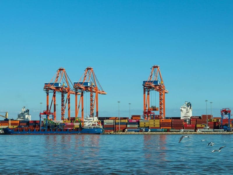 Manufacturing & trade: A container port with cargo cranes. Photo by Nezaket on Pexels.