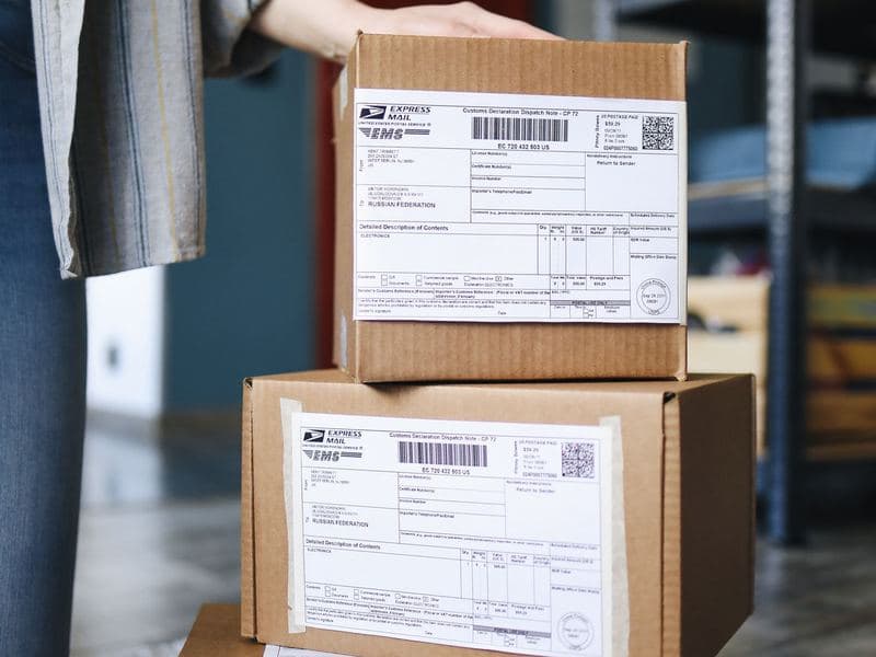 Retail & e-commerce: Parcels stacked for delivery. Photo by Polina Tankilevitch on Pexels.